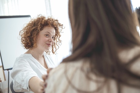 a woman talking to a counsellor