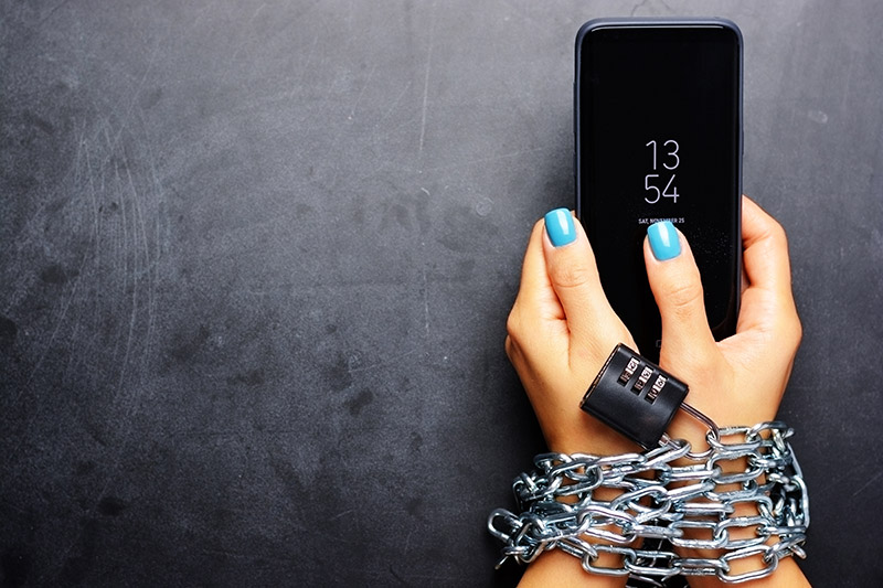 a mobile phone with chains around it